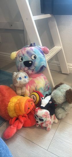 Lot of stuffed animals including Minecraft dog