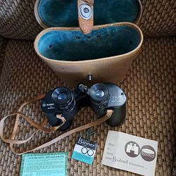 Vintage Bushnell Binoculars from 1960 with original case and paperwork also has original strap 