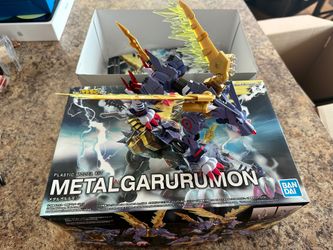 Bandai digimon model with box and book