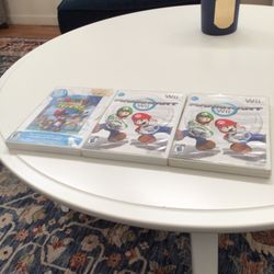 Three Nintendo Wii games mint Condition Mario mart Mario Power