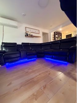Black leather sofa with blue LED lights