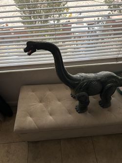 Tall Dinosaur With Wheels