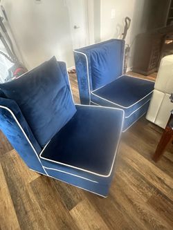2 royal blue arm chairs