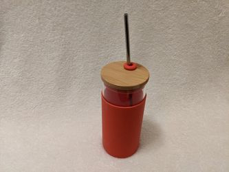 Glass Tumbler With Steel Straw, Red Silicone Sleeve.