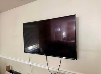 LG 55’ TV with remote and wall mount
