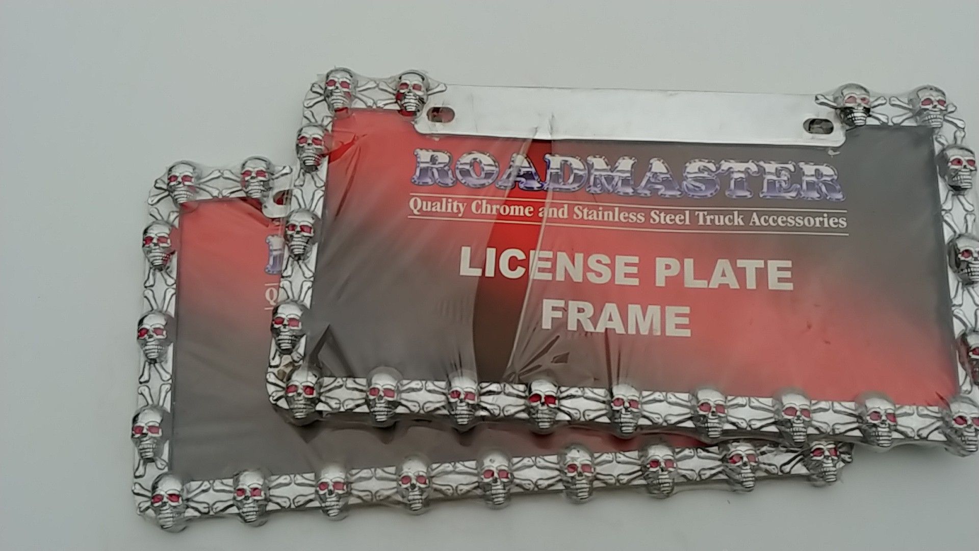 Pair of skull license plate frames