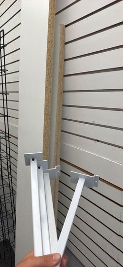 A lot of slat walls and shelves