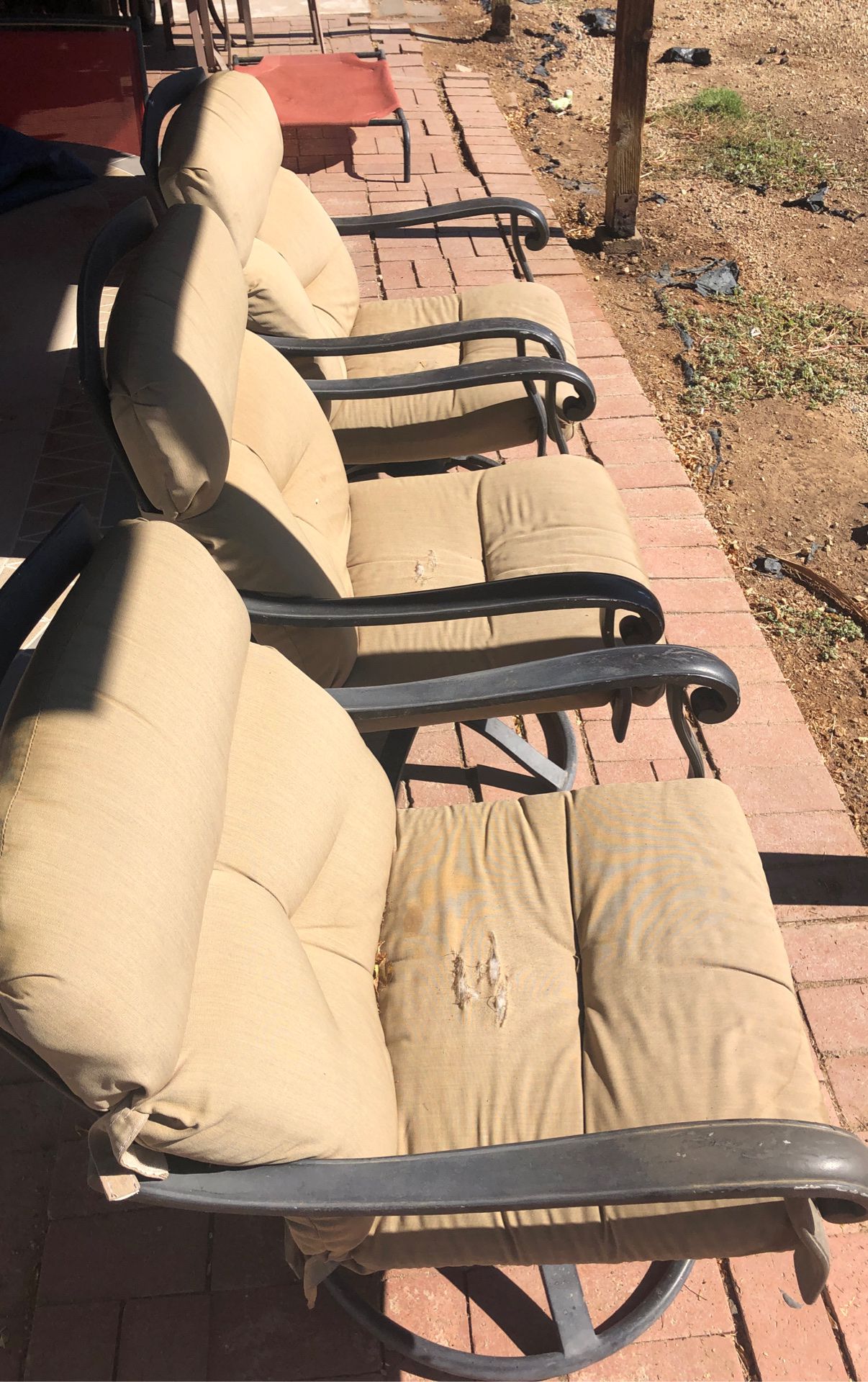 Three swivel patio chairs