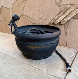 Metal Hose Pot/Holder or even a Planter