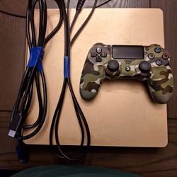 Playstation 4 limited edition gold console and it comes with a controller and the wires