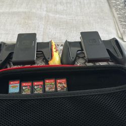 5 Games and a case and Two controllers of Nintendo Switch 