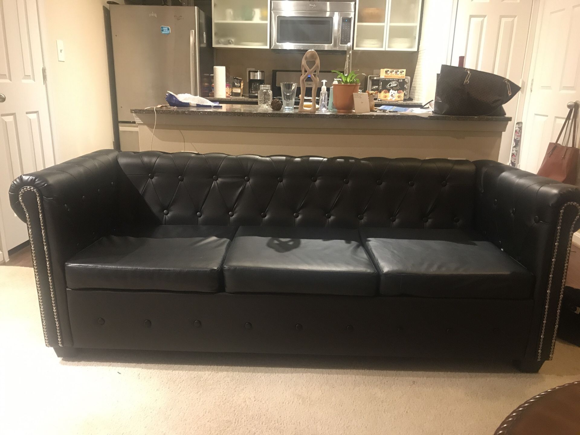 Tufted black button little sofa