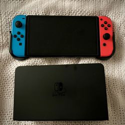 Nintendo Switch OLED video game handheld console 2024 Neon Joy Cons