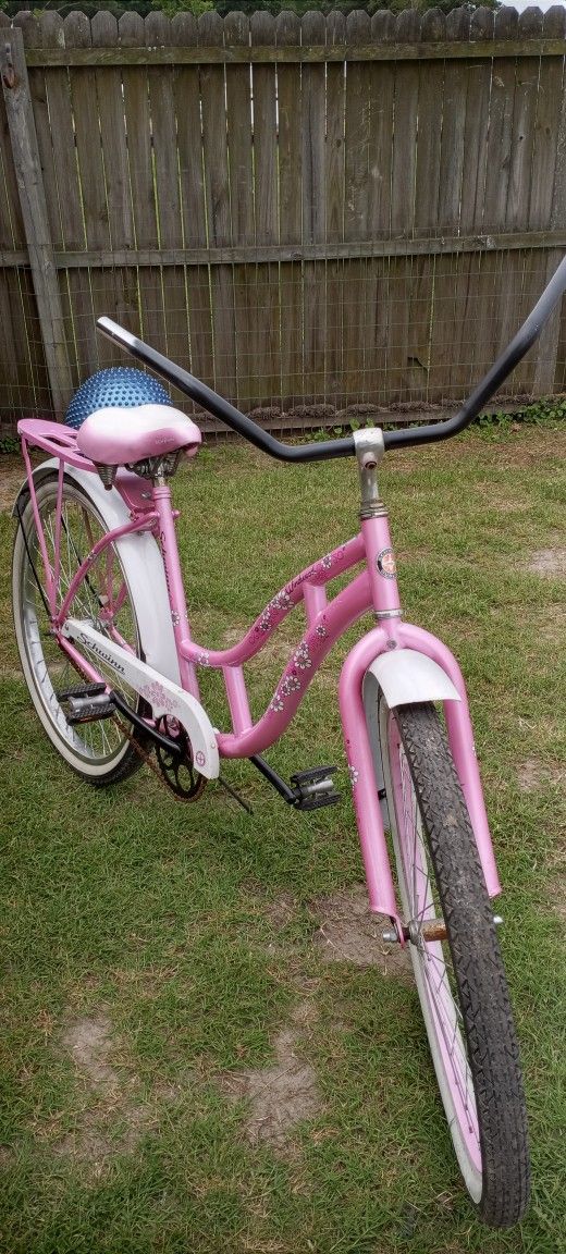 Women's 26 Inch Huffy Pink and White bicycle, and a man's 26 Inch Black Huffy Bike