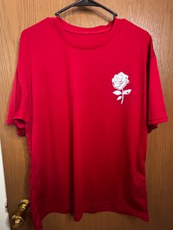 Red shirt with white silhouette of a rose