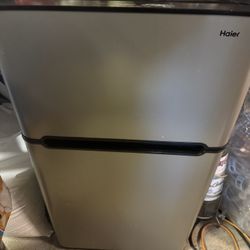 Small silver Refrigerator 33 long 19 wide 18 depth