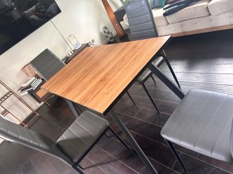 Dinner table set with 4 chairs