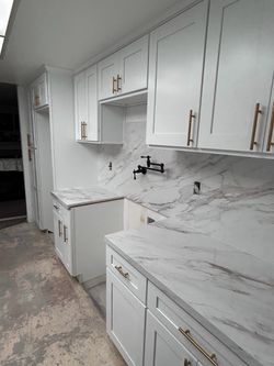 White Shaker Kitchen Cabinets with Marble Countertops