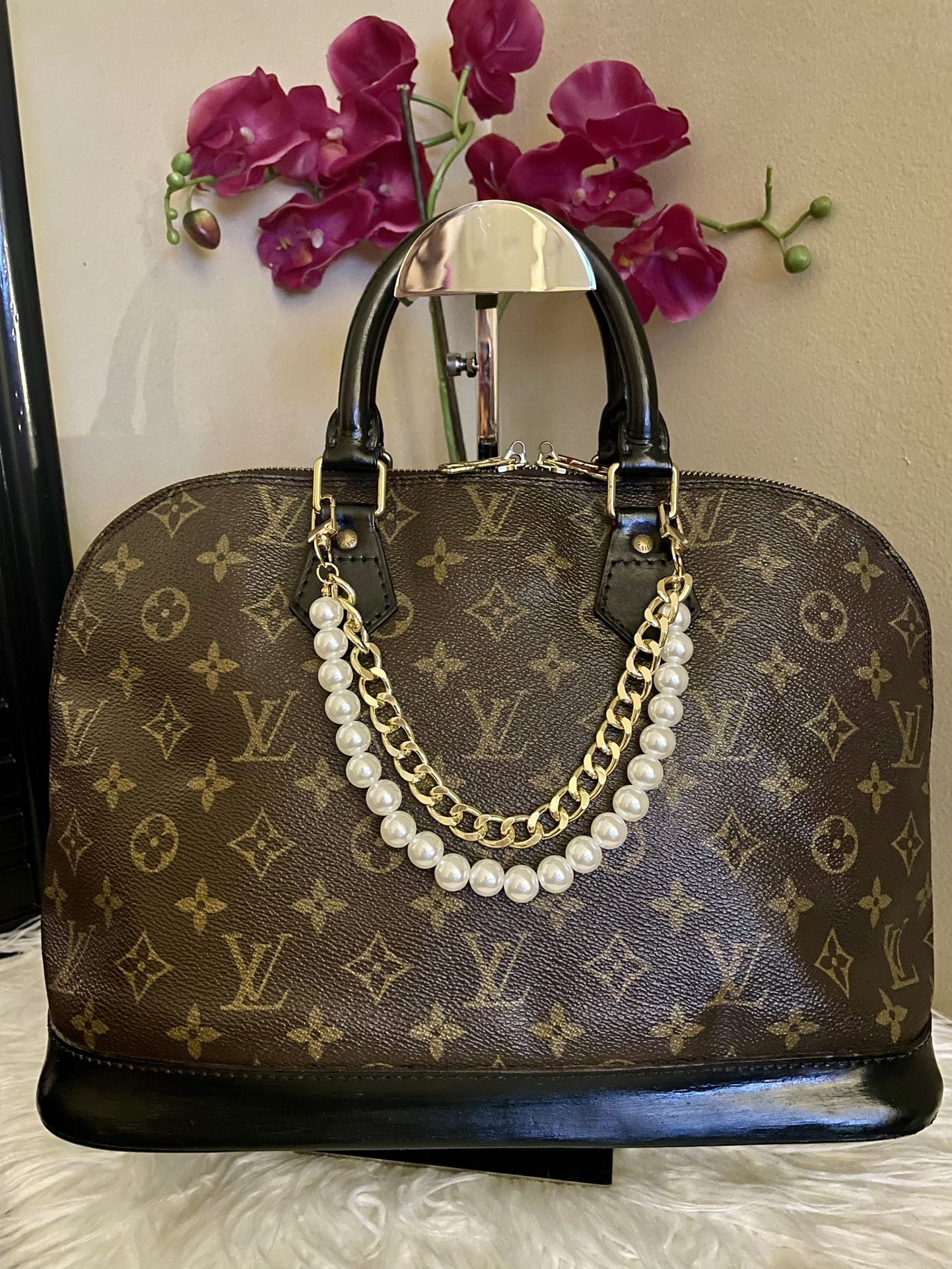 Louis Vuitton Alma Handbag