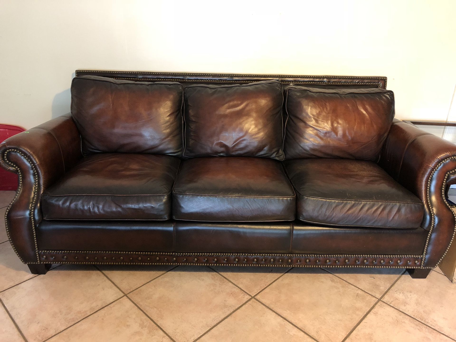 Two Beautiful all leather sofas take one or take both for $200.00 each. Ottoman $65.00