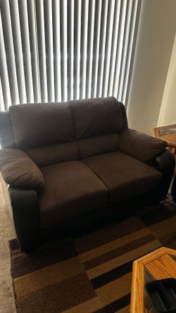 Living room set, dark brown 3 and 2 seater couches leathers & suede.