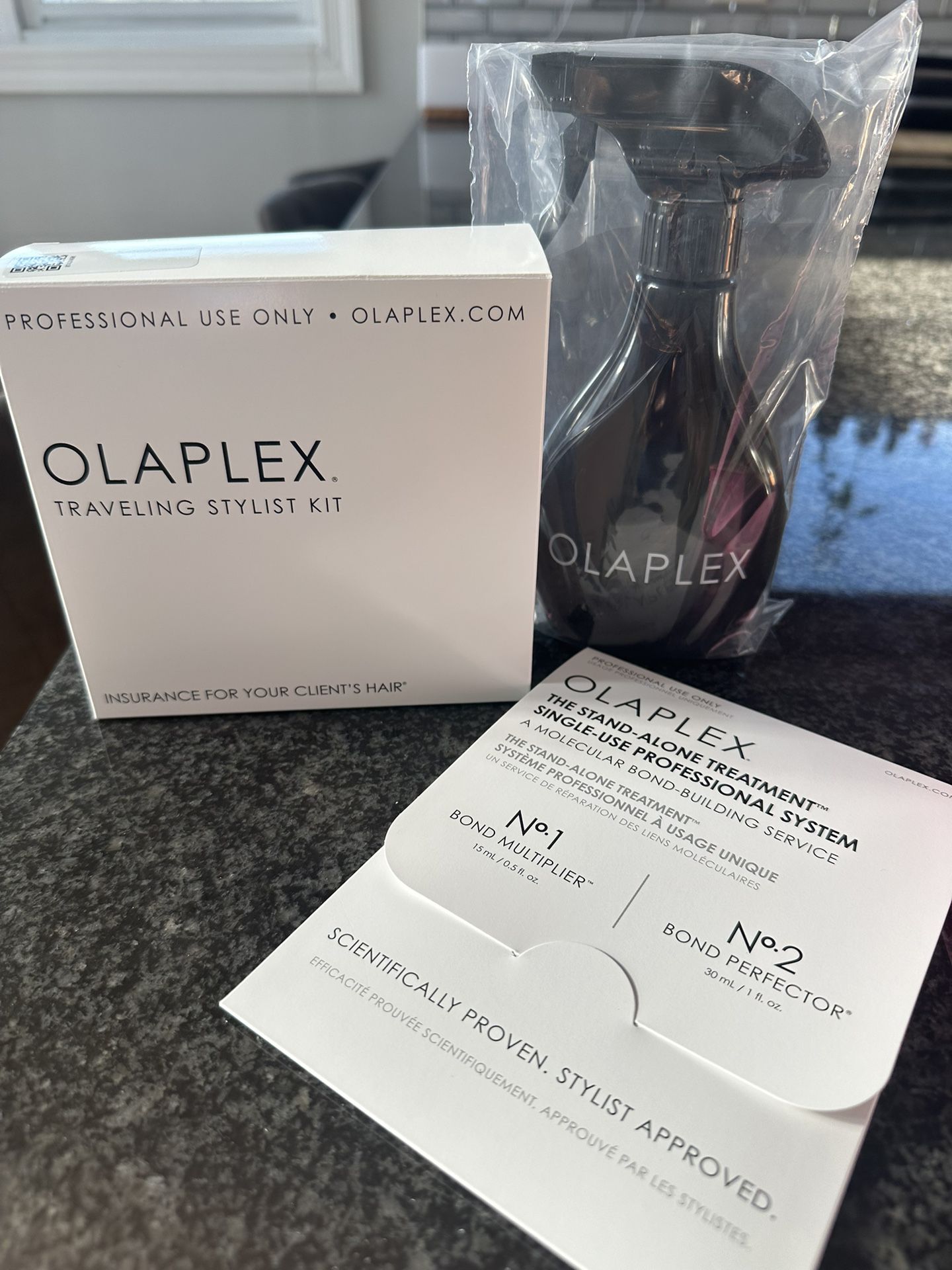 Olaplex traveling stylist kit, standalone treatment and spray bottle