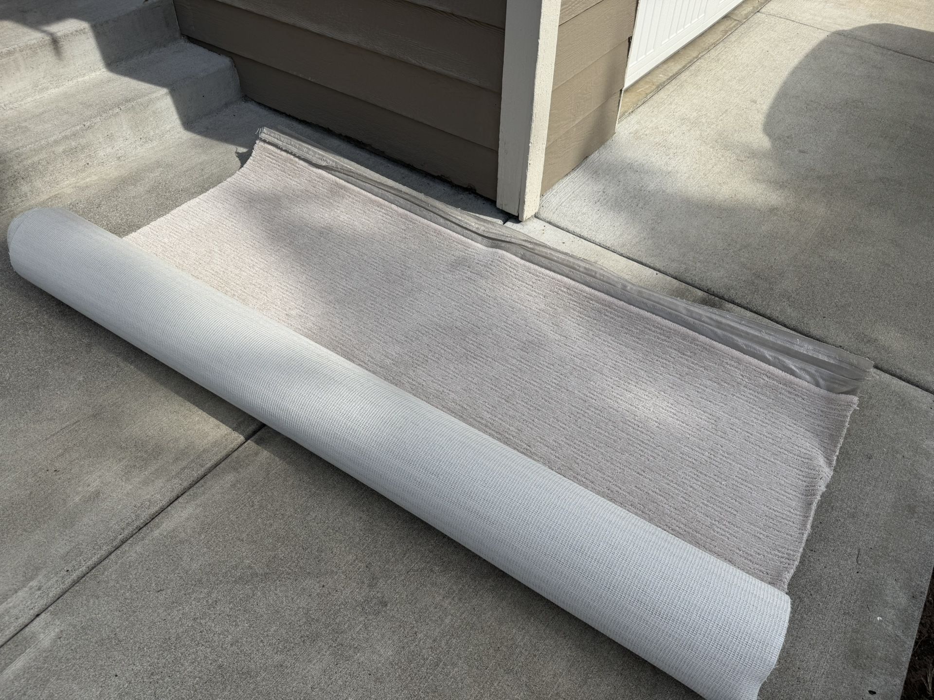 Brand new Carpet piece 12ft by6ft. ( 80$ ) white/ beige color