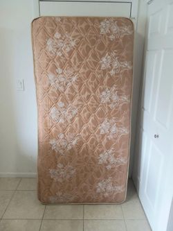 Vintage twin size mattress with floral pattern