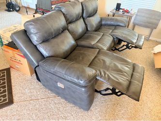 Gray leather power reclining three seat sofa