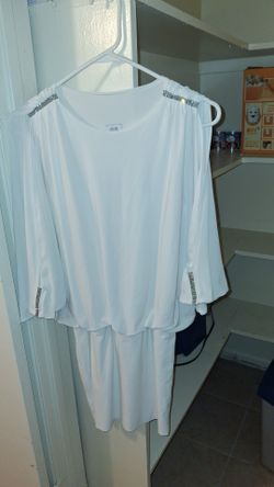 Women's white colored cocktail dress, with open sleeves and flared out sleeves, as well as rhinestones on the top the  sholders, as well as the wrist 