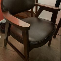 Two Leather And Wood Chairs 