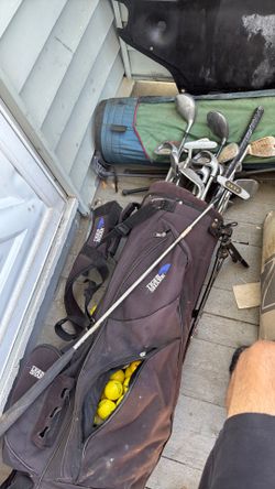 Golf clubs with 2 bags has balls inside