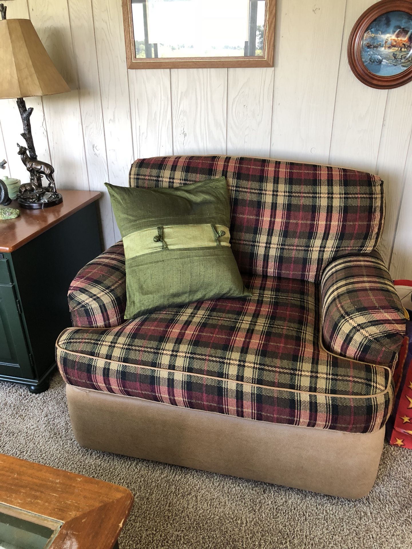 2 pc. Sectional with 2matching chairs. Also comes with a glass coffee table and end table. Green and rust.