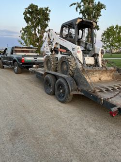 BOBCAT S650 With Dump Trailer