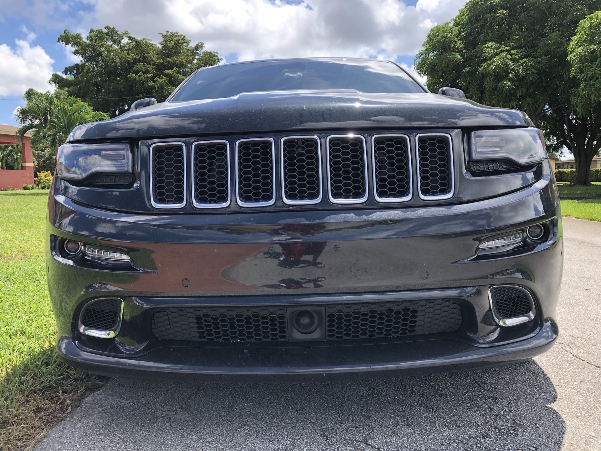 2015 Jeep grand Cherokee SRT front bumper complete with fog lights sensor top and bottom grill with bumper insert
