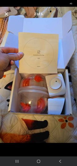 Imani wireless breast pump w/ bottle warmer milk storage bags