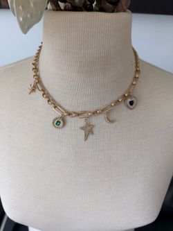 aerie golden charm chain necklace with 5 charms heart, crescent, stars, oval stone with adjustable chain  In excellent condition