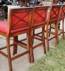 4 red upholstered bar stools. great condition commercial grade $100