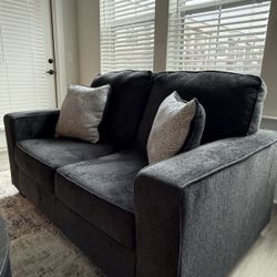 Ashley Furniture sofa, bought less than a year ago. No stains, no scratches — super clean. No pets and no kids in the home.