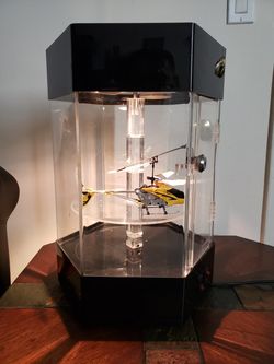 Spinning display case with light