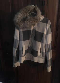 Beautiful checkered brown and beige with her in it for winter jacket slightly used extra large size