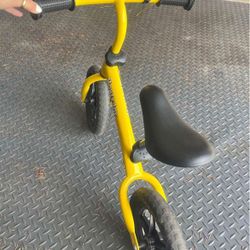 Yellow toddler balance bike