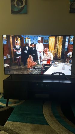 55 inch Roku Smart tv with stand, and Roku remote