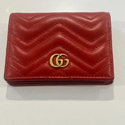 Red Gucci GG Marmont wallet with gold hardware