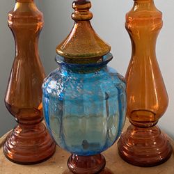 This is a vintage Empoli glass apothecary jar And vintage amber glass vase.