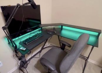 desk with monitor stand with LED color lights, gaming hooks, and power outlets