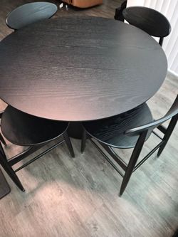 Round black dining table