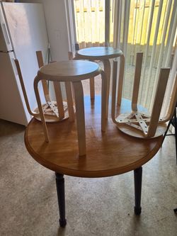 table with its 4 small stools