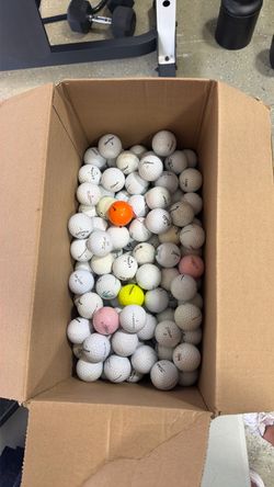 About 190 used golf balls
