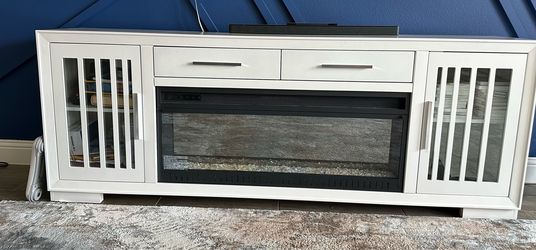Console with electric log fireplace